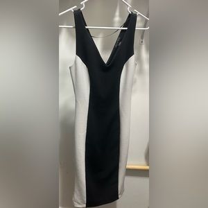 Metaphor black and white dress size XS. Zip up, v neckline, past knee length